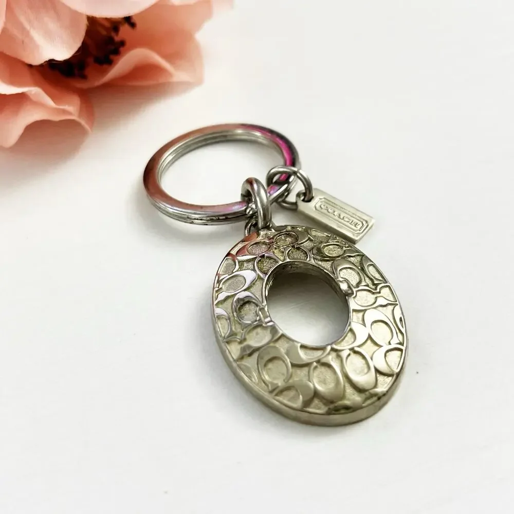 Coach Silver Tone Oval Signature C Keychain